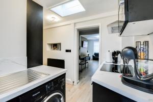 a kitchen with a sink and a dishwasher at Ripon By Serene Stays Stylish Liverpool Home Sleeps 5 with Free Parking Fast WiFi and Close to Stadiums in Liverpool