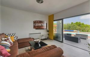 a living room with a couch and a table at Villa Primavera in Buje
