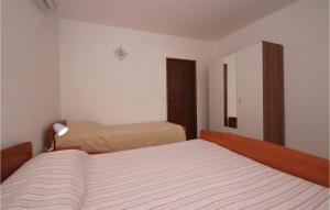 Postel nebo postele na pokoji v ubytování Apartment Korcula With Sea View Vi