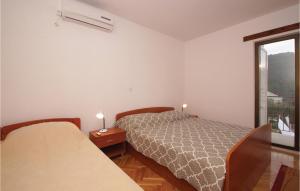 Postel nebo postele na pokoji v ubytování Apartment Korcula With Sea View Vi