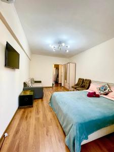 Katil atau katil-katil dalam bilik di Золотой Квадрат на проспекте Достык