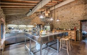 a kitchen with a large stainless steel counter top at Casa Politi in San Giustino Valdarno