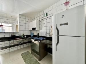 Η κουζίνα ή μικρή κουζίνα στο Praia Do Morro - edificio Porto Belo +12 φωτογραφίες