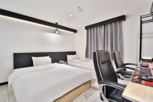 Postel nebo postele na pokoji v ubytování No 25 Hotel Yonghyun