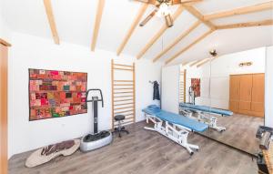 a therapy room with two beds and a ladder at Cozy Apartment In Kastel Novi in Kastel Novi