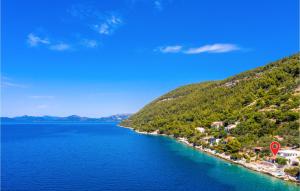 a view of a body of water with a mountain at Holiday Home Slano Majkovi-Ratac in Slano