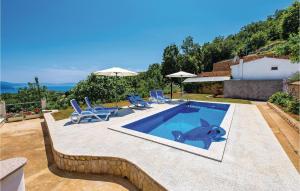 a swimming pool with a picture of a shark on it at Nice Home In Brsec With House Sea View in Zagorje +40 photos