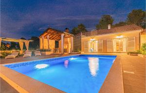 a swimming pool in front of a house at 3 Bedroom Gorgeous Home In Jadrtovac in Jadrtovac +36 photos