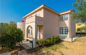 a large house with a yard at Awesome Apartment In Barbat-Rab in Barbat na Rabu