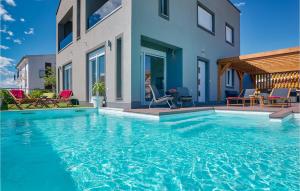 a swimming pool in front of a house at Villa Amy in Zadar +53 photos