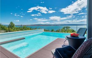 a swimming pool with a view of the ocean at Villa Amy in Zadar