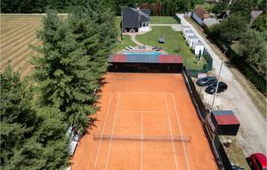 an overhead view of a tennis court with trees at Amazing Home In Fericanci With Sauna in FeriÄanci