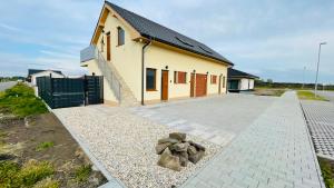 a building with a pathway in front of it at HENRY APARTMENT - Nesvady - Slovakia in Nesvady