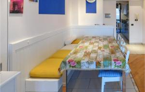 a room with a table with flowers on it at Villa Castiglioni 031 in Luino +12 photos