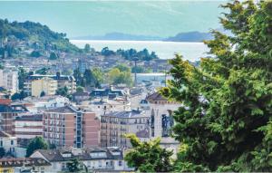 a city with buildings and the water in the background at Villa Castiglioni 031 in Luino