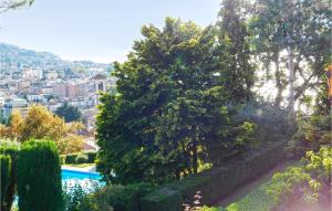 a view from the garden of a house with trees at Villa Castiglioni 031 in Luino
