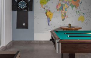 a map of the world on a wall with a pool table at Villa Ancora in Jadranovo