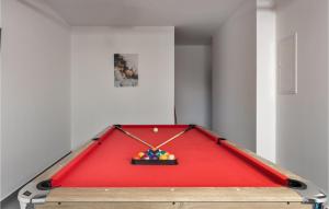 a ping pong table with a red top at Stunning Home In Crikvenica in Crikvenica