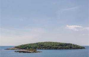 an island in the middle of the ocean at One-Bedroom Apartment In Gruda in Gruda +14 photos