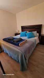 Ένα ή περισσότερα κρεβάτια σε δωμάτιο στο departamento 6 Arica verano 2 habitaciones