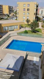 Πισίνα στο ή κοντά στο departamento 6 Arica verano 2 habitaciones
