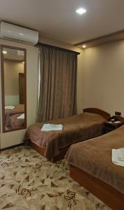Postel nebo postele na pokoji v ubytování Areg Hotel + 37 fotografií