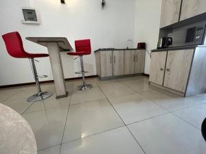 Η κουζίνα ή μικρή κουζίνα στο Modern Studio in the heart of Flic en Flac