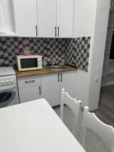 Køkken eller tekøkken på CityLuxe Apartments