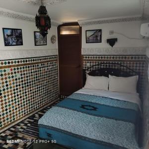 Postel nebo postele na pokoji v ubytování Riad amal + 37 fotografií