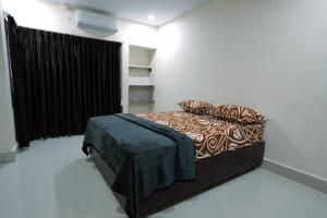 Postel nebo postele na pokoji v ubytování Sandeep Serviced Apartments