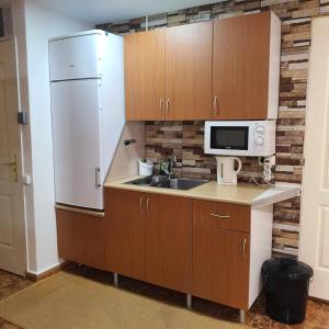 Kuchnia lub aneks kuchenny w obiekcie Cozy rooms in terraced house