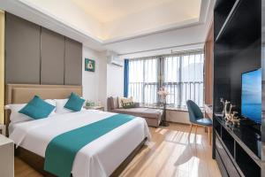 TV a/nebo společenská místnost v ubytování Hantao AI Select International Apartment