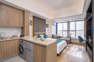 Kuchyň nebo kuchyňský kout v ubytování Hantao AI Select International Apartment