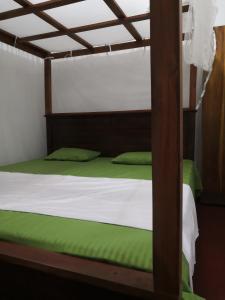 Ένα ή περισσότερα κρεβάτια σε δωμάτιο στο Green Villa