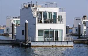 a house on a dock in the water at Captain Jack Sparrow in Olpenitz