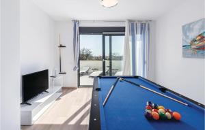 a living room with a pool table and a tv at Beautiful Home In Pula With Kitchen in Pula