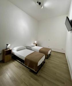 Ένα ή περισσότερα κρεβάτια σε δωμάτιο στο Cristina Home