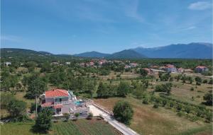 an aerial view of a house in a field at Nice Home In Zrnovnica-Split With Sauna in Cista Provo +29 photos