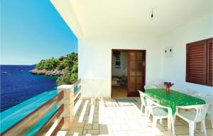 a dining room with a view of the ocean at Apartment Prizba 57 in Prizba