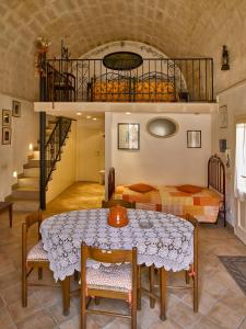 a living room with a table and a loft at Sax Barisano in Matera