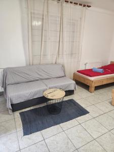 A bed or beds in a room at Orsi Apartman / vendegház