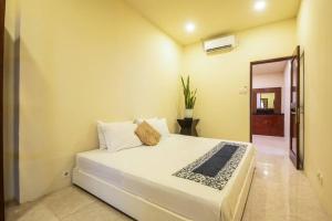 Giường trong phòng chung tại Villa 5A Canggu Brawa