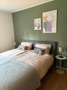 a bedroom with a bed with two pillows on it at Bij de Buurman in Dalmsholte