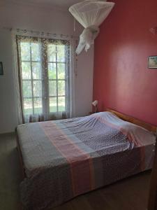 Postel nebo postele na pokoji v ubytování Maison de charme à Manapany
