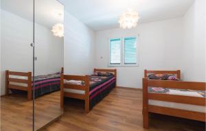 Ein Bett oder Betten in einem Zimmer der Unterkunft Four-Bedroom Apartment In Klek
