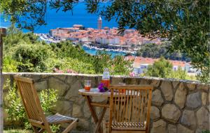 a table and chairs with a view of a city at 3 Bedroom Cozy Home In Palit in Palit +44 photos