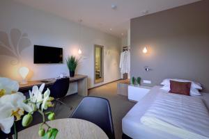 Postel nebo postele na pokoji v ubytování Hotel Kapellenberg