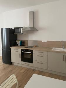 Kuchyň nebo kuchyňský kout v ubytování Appartement 55m2 centre ville