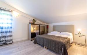 a bedroom with a large bed and a mirror at Apartment Krilo Jesenice 24 in Jesenice +19 photos