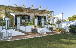 a white house with a staircase in the yard at 6 Bedroom Pet Friendly Home In Siracusa in Siracusa